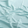 Close-up of the fabric of the Marsh Hoodie in aqua color.