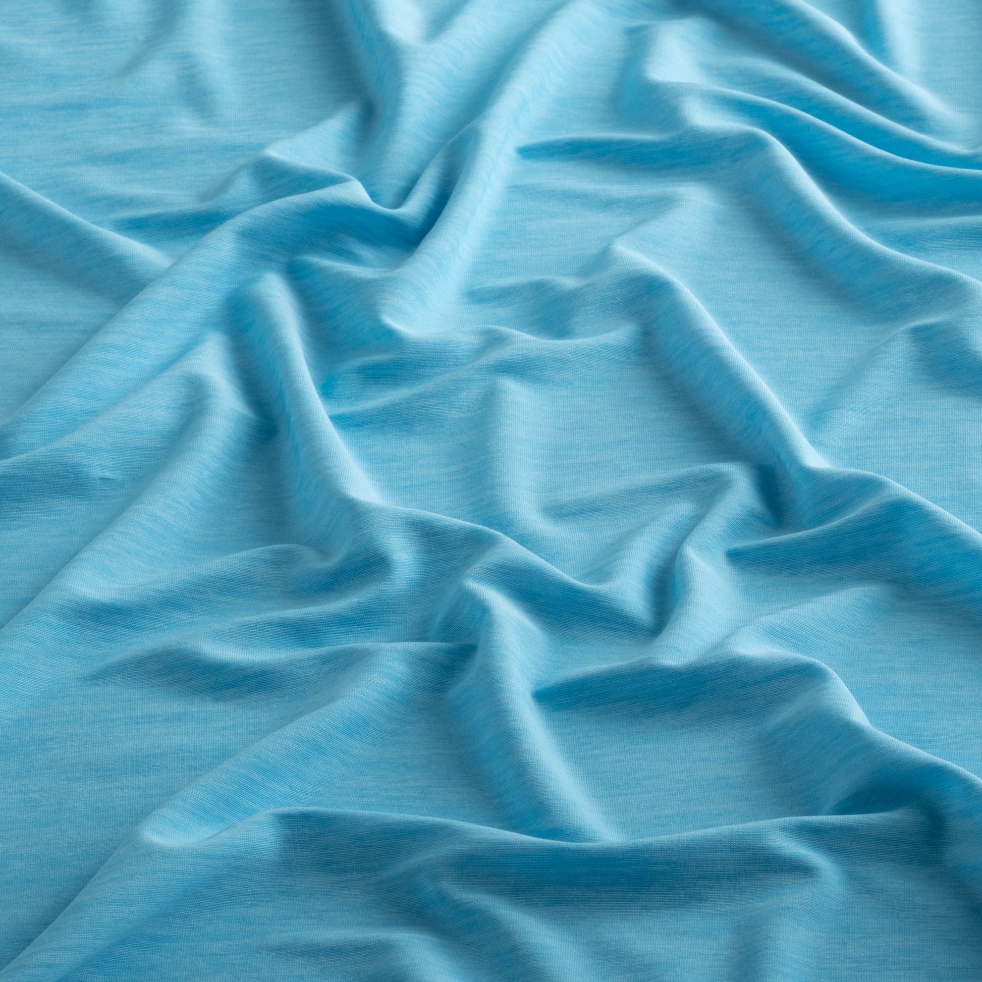 Close-up of the fabric of the Marsh Hoodie in sea island blue color.