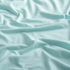 Close-up of the fabric of the Sport Hoodie in aqua color.