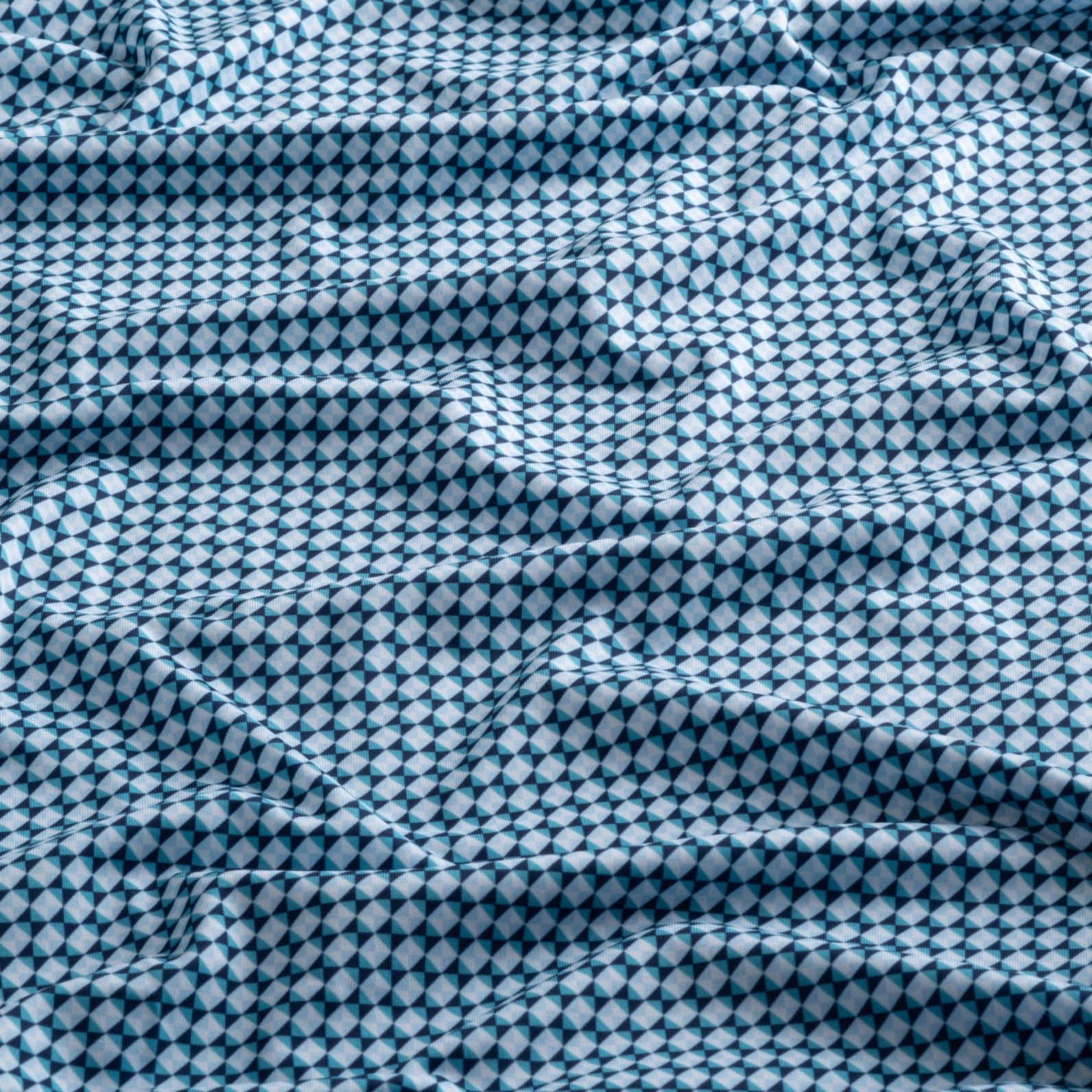 Close-up of the fabric of The Folly Checkered in Checker Tide.