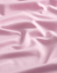 Close-up of the fabric of The Seabrook Performance 1/4 Zip in Mills Pink.