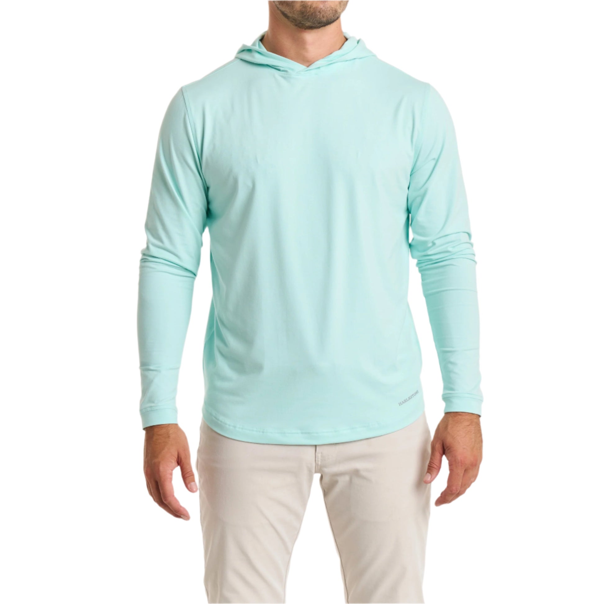 Close-up of a man wearing the Sport Hoodie in aqua color with cream white color pants, cropped from chin to knees, against a solid white background.