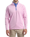 Close-up of a man wearing The Seabrook Performance 1/4 Zip in Mills Pink with white cream pants, cropped from chin to knees, against a solid white background.