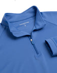 Close up of The Seabrook Performance 1/4 Zip's neck area in Marine Blue.