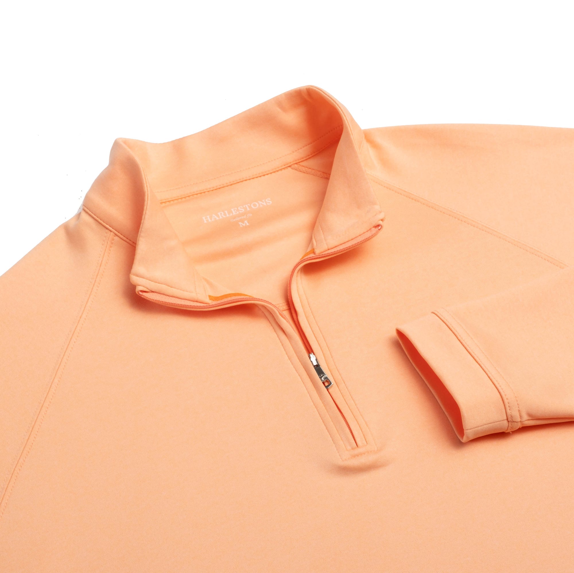 Close up of The Sullivans Pullover&#39;s neck area in citrus color.