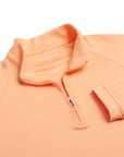 Close up of The Sullivans Pullover's neck area in citrus color.