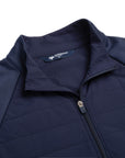 Close up of The Traveler Jacket's neck area in beaufain blue and zipper closing the jacket.